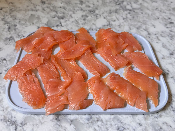 Smoked salmon cut into strips.