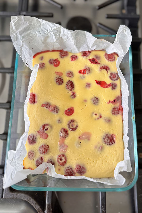 Raspberry baked yogurt in a baking dish right from the oven.