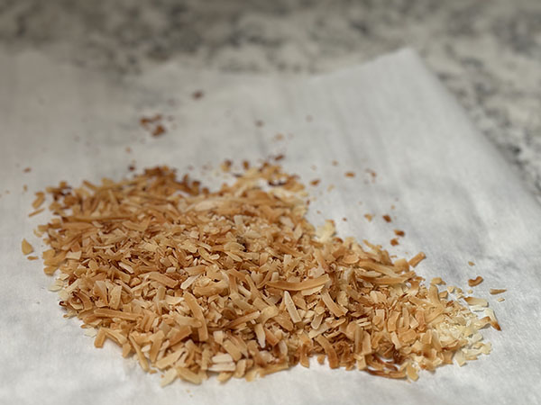 Toasted coconut on parchment paper.