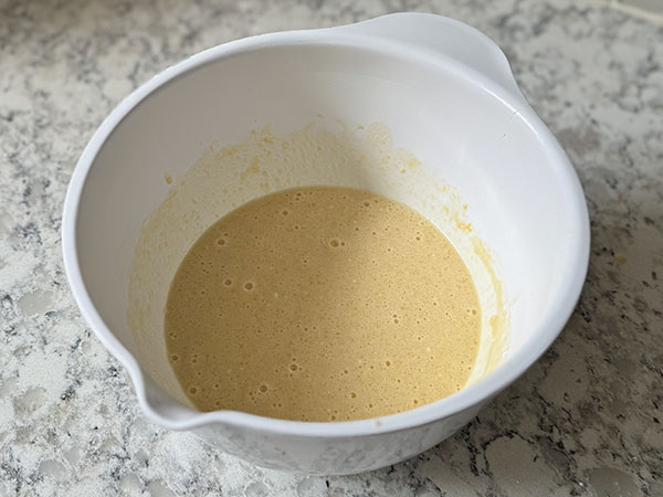 Apple cake batter in a large bowl.