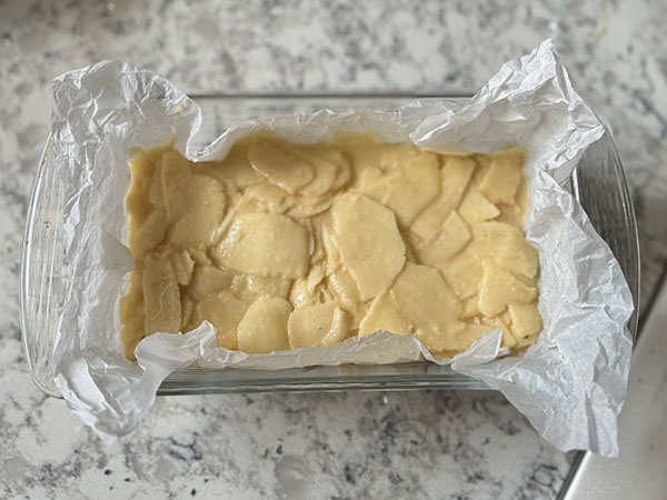 Apple mixture in a loaf pan ready for the oven.