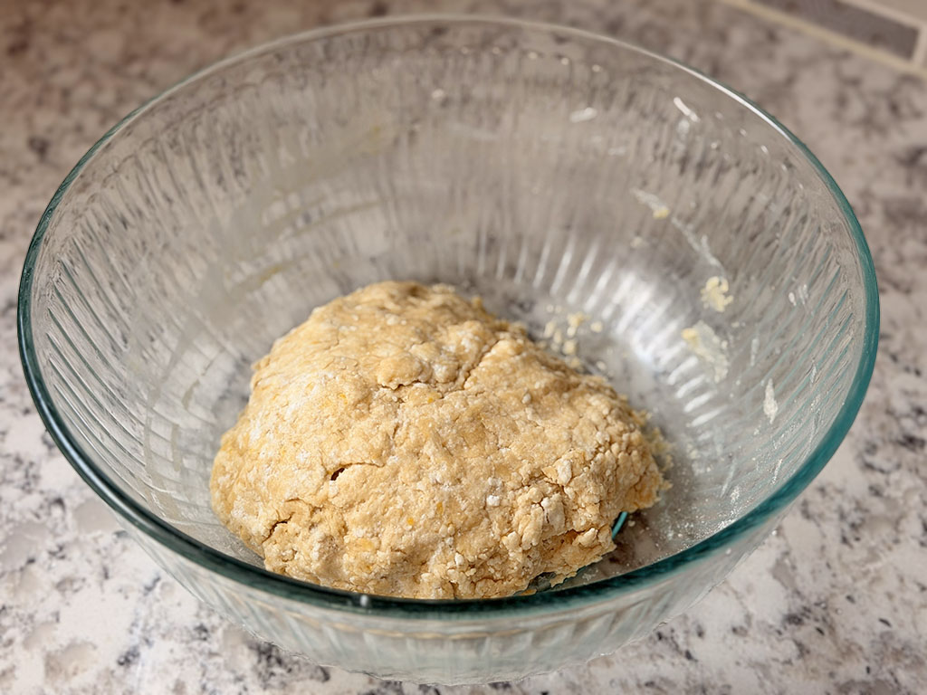 Soft cookie dough fully mixed in a large bowl.